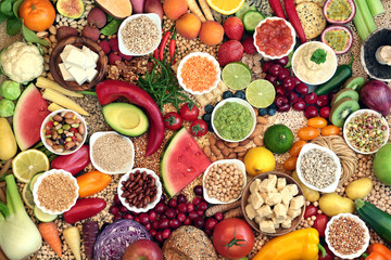 Large vegan health food collection with foods hgh in protein, vitamins, minerals, anthocyanins, antioxidants, fibre, omega 3 and smart carbs. Healthy ethical eating concept. Flat lay.