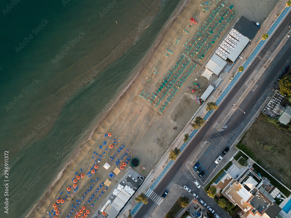 Fototapeta Top view of a beach relaxation area with beach umbrellas. Terracina, Latin Province, Lazio, Italy