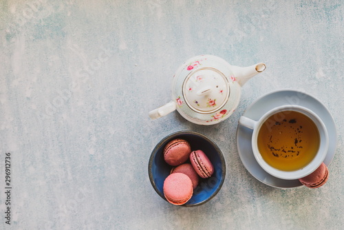pink macaroons with teapot and Cup