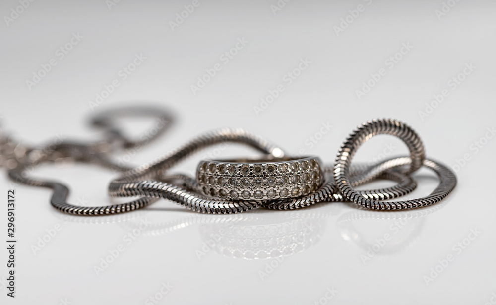 Delicate silver diamond ring and silver chain with elegant design Delicate silver diamond ring and silver chain with elegant design