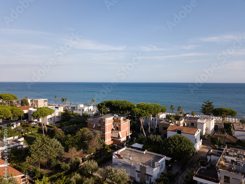 Top view of a coastal town with a beach and beach umbrellas. Terracina, Province of Latina, Lazio Region, Italy
