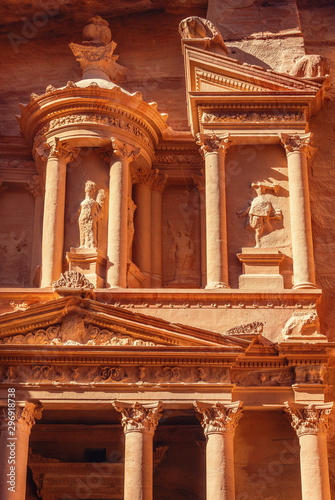 The beautiful decorations of the facade of the Treasury (Al Khazneh) temple, Petra, Jordan, bathed by early morning sun.