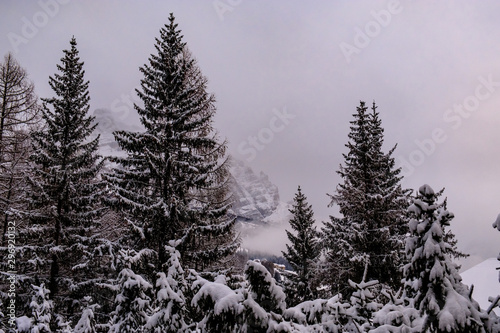 Stormy clouds in italian dolomites in a snowy winter © zakaz86
