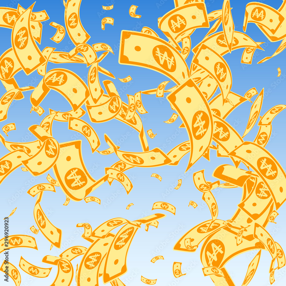 Fototapeta premium Korean won notes falling. Random WON bills on blue