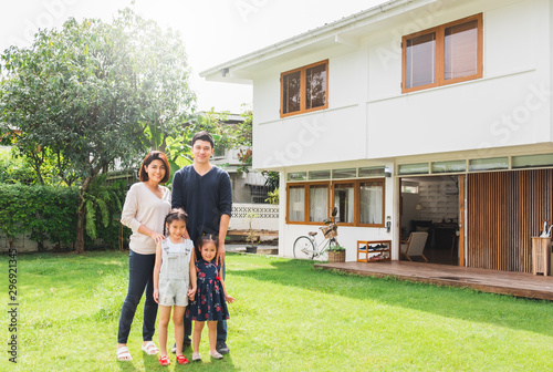 Portrait Asian family front of house, happy family home concept