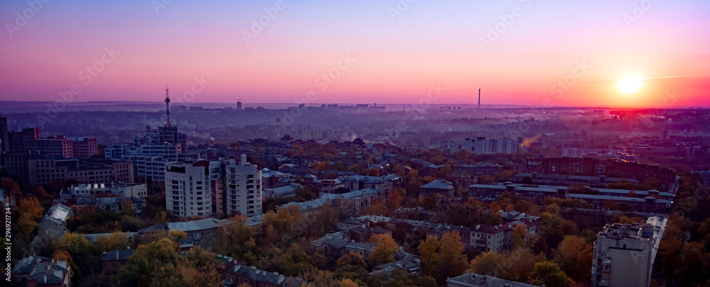Aerial view of sun rises over summer European city