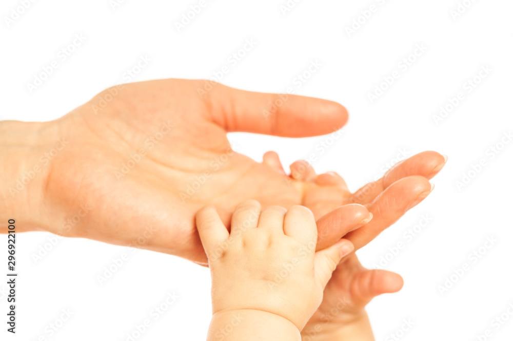 Hands of a small newborn baby hold on to fingers Hands of a small newborn baby hold on to fingers