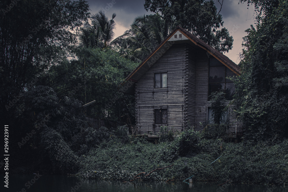 The old wooden house that was left by the river. 