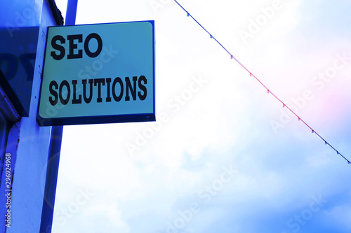 Word writing text Seo Solutions. Business photo showcasing Search Engine Result Page Increase Visitors by Rankings Green ad board on the street with copy space for advertisement photo