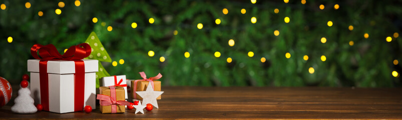 Christmas banner, Gifts and ornaments on old wooden floor