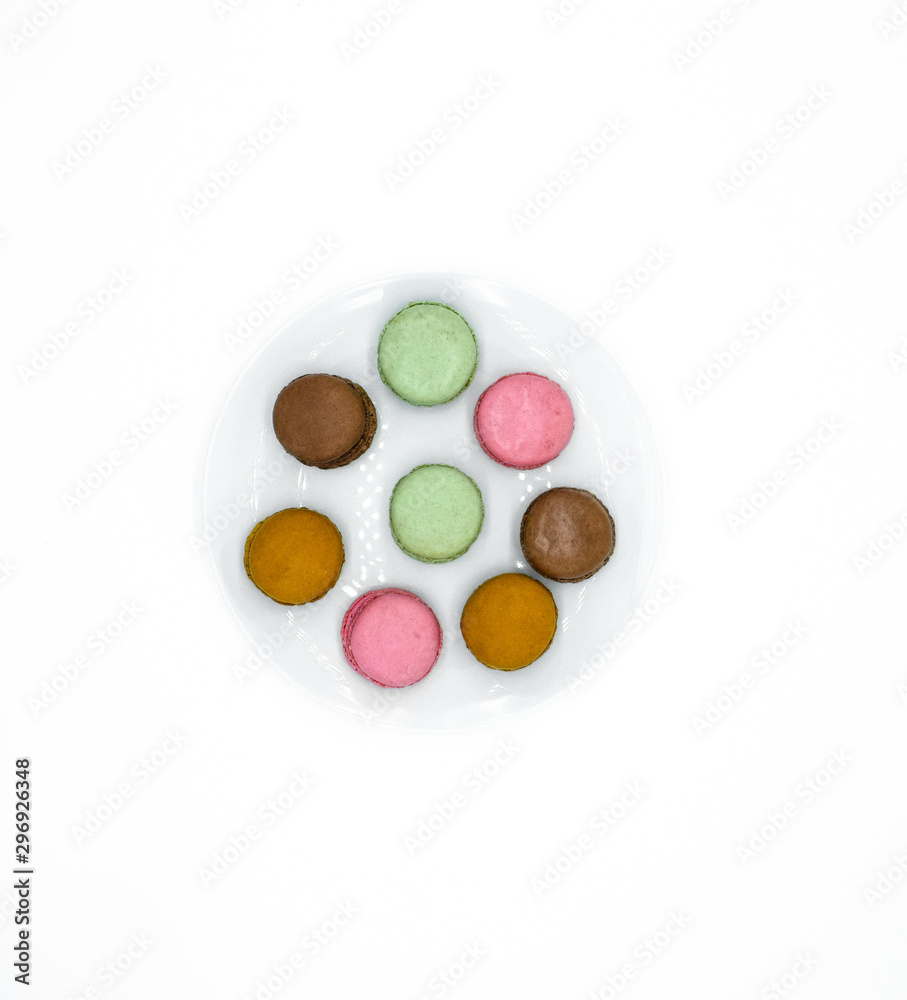 macarons on plate, sweet colorful macarons on white background macarons on plate, sweet colorful macarons on white background