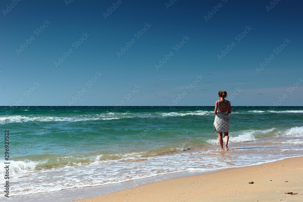 summer seascape girl on a beautiful beach summer seascape girl on a beautiful beach