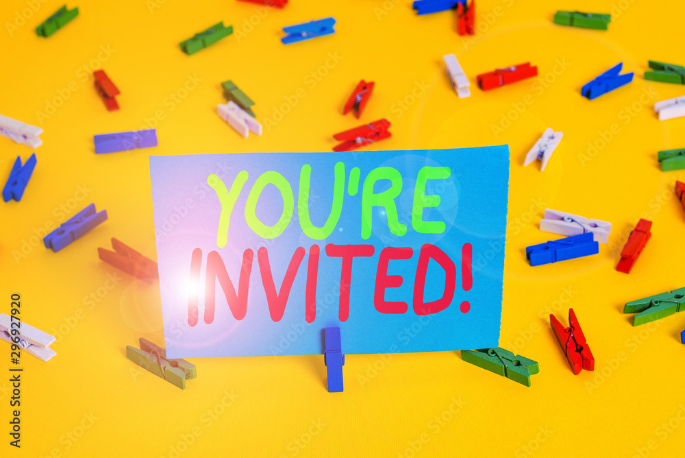 Writing note showing You Re Invited. Business concept for make a polite friendly request to someone go somewhere Colored clothespin papers empty reminder yellow floor background office Writing note showing You Re Invited. Business concept for make a polite friendly request to someone go somewhere Colored clothespin papers empty reminder yellow floor background office