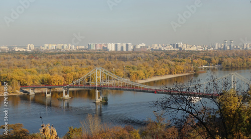 View of the pedestrian bridge and the Dnieper river in Kiev on a sunny autumn day