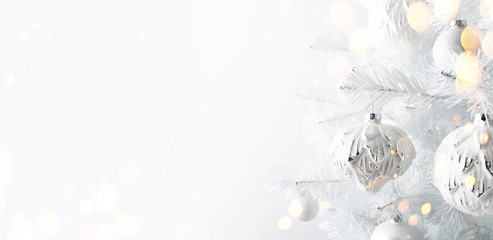 Decorated white ornaments Christmas tree on white background. Merry Christmas and Happy Holidays greeting card, frame, banner. New Year.