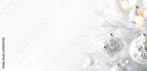 Slika na platnu Decorated white ornaments Christmas tree on white background