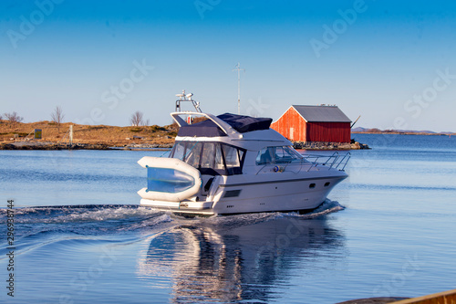 Leisure boat through Brønnøysundet in Nordland county photo