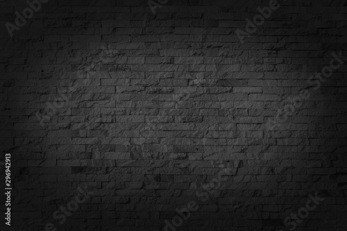 Black brick walls that are not plastered background and texture. Background and texture gray stone cladding wall.