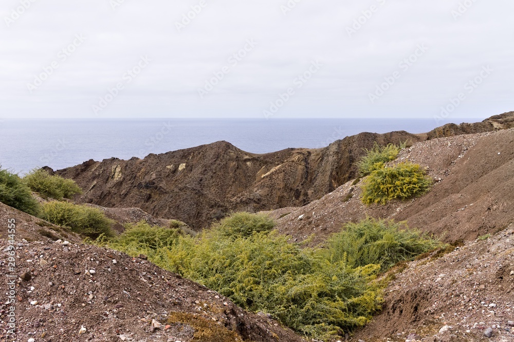 Panoramic view of the Atlantic Ocean behind a desertic place in Porto Santo (Madeira Islands, Portugal)