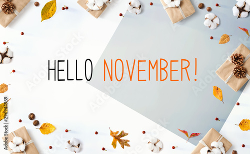 Hello November message with gift boxes with autumn leaves