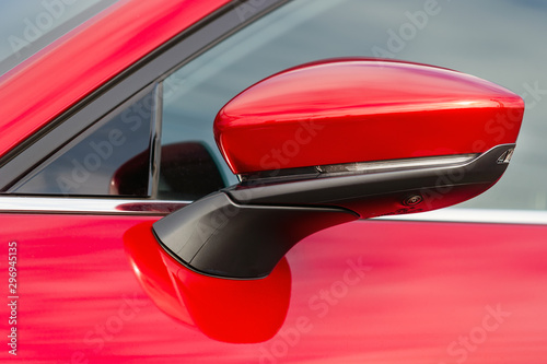 Wing mirror of red car