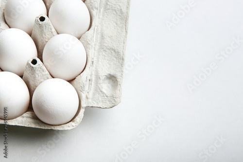 template with packing of chicken eggs on a white background with copy space photo