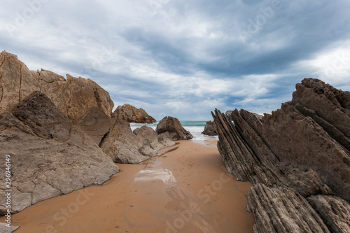 Flysch rock formation at a north atlantic ocean beach in spain near bilbao and santander during winter time.