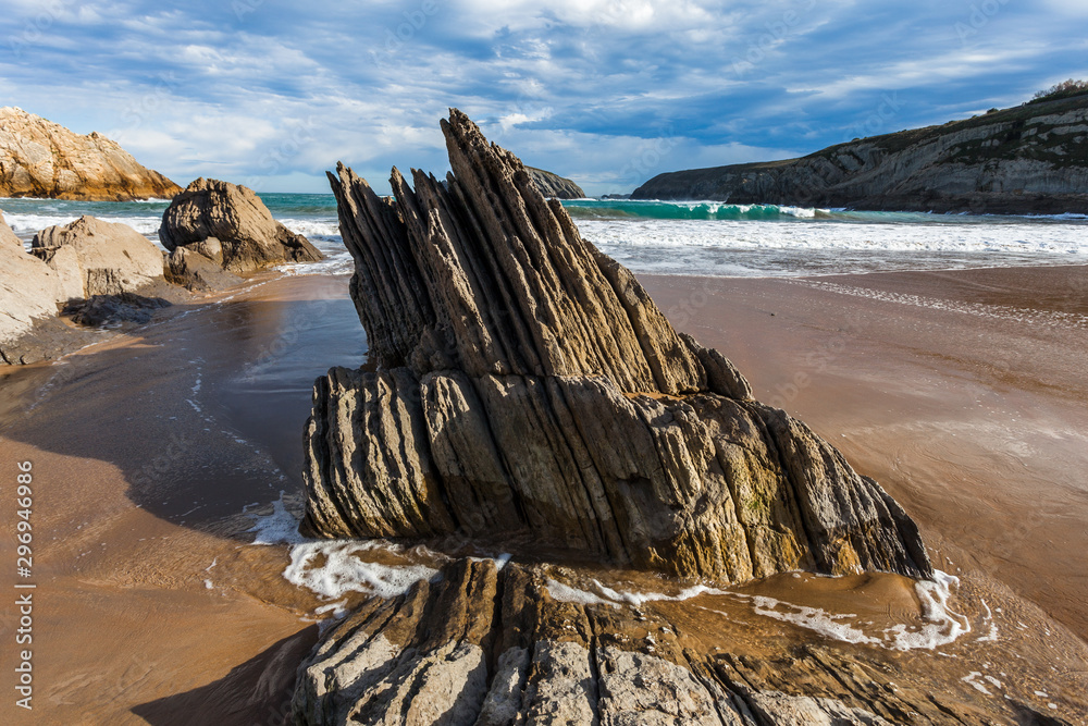 Flysch rock formation at a north atlantic ocean beach in spain near bilbao and santander during winter time. Flysch rock formation at a north atlantic ocean beach in spain near bilbao and santander during winter time.