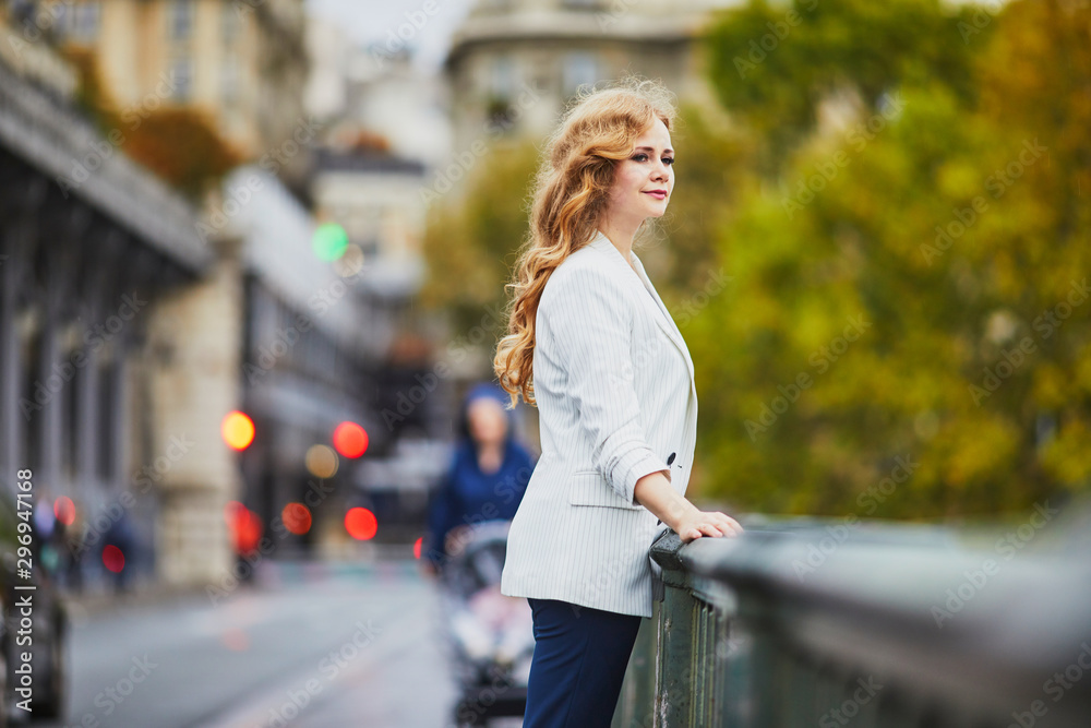 Young woman with long blond curly hair in Paris, France Young woman with long blond curly hair in Paris, France