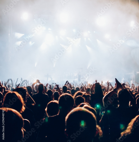 crowd at concert and stage lights with space for text