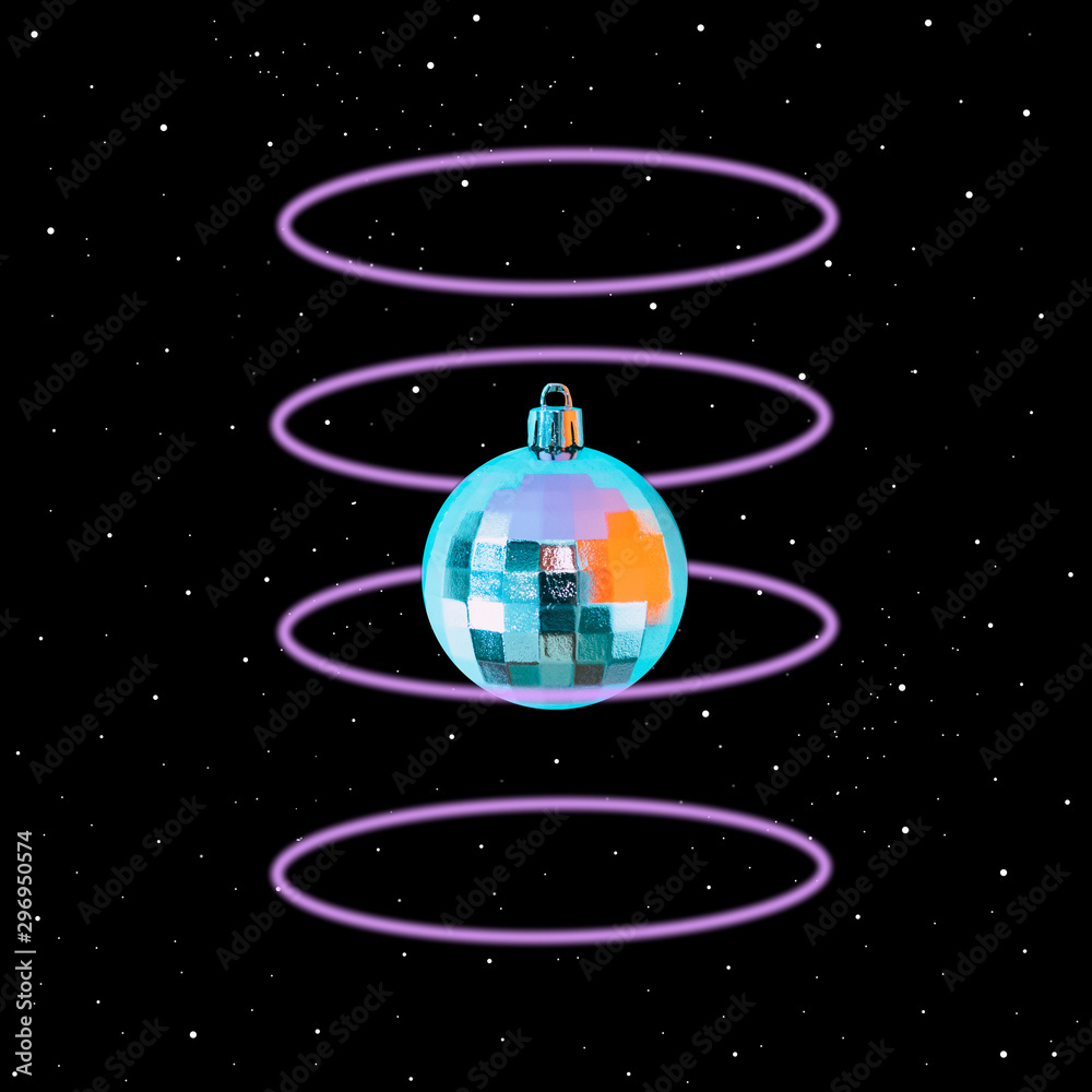 Christmas ball decoration flies in deep space among neon light rings. Art collage concept of 90s or 80s Christmas ball decoration flies in deep space among neon light rings. Art collage concept of 90s or 80s