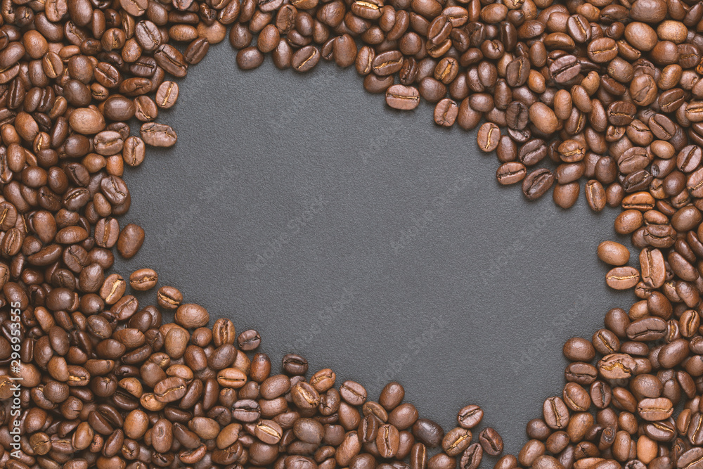 Roasted coffee beans frame background on black with copy space Roasted coffee beans frame background on black with copy space