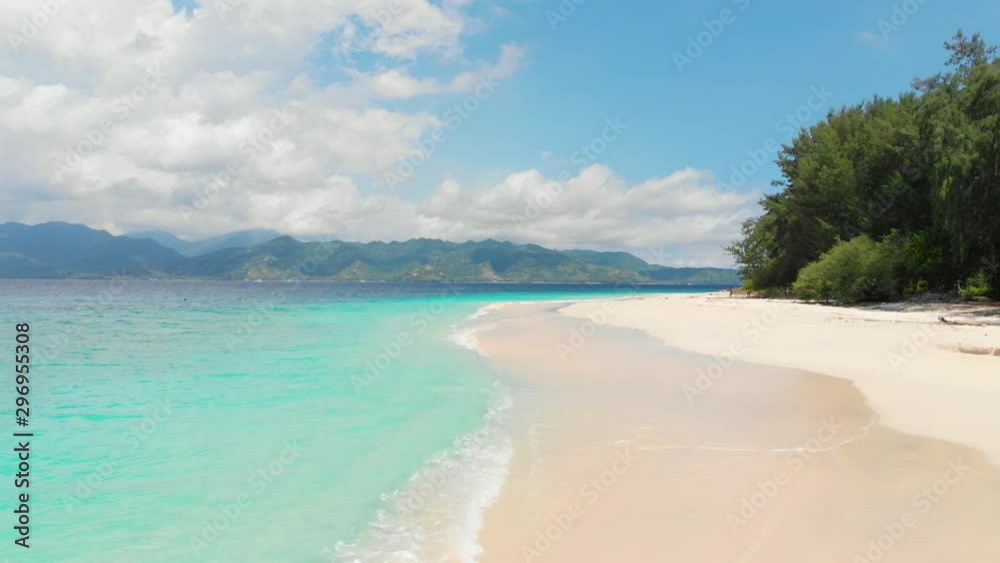 Tropical beach with white sand and blue ocean. Aerial view. Paradise tourist location Tropical beach with white sand and blue ocean. Aerial view. Paradise tourist location