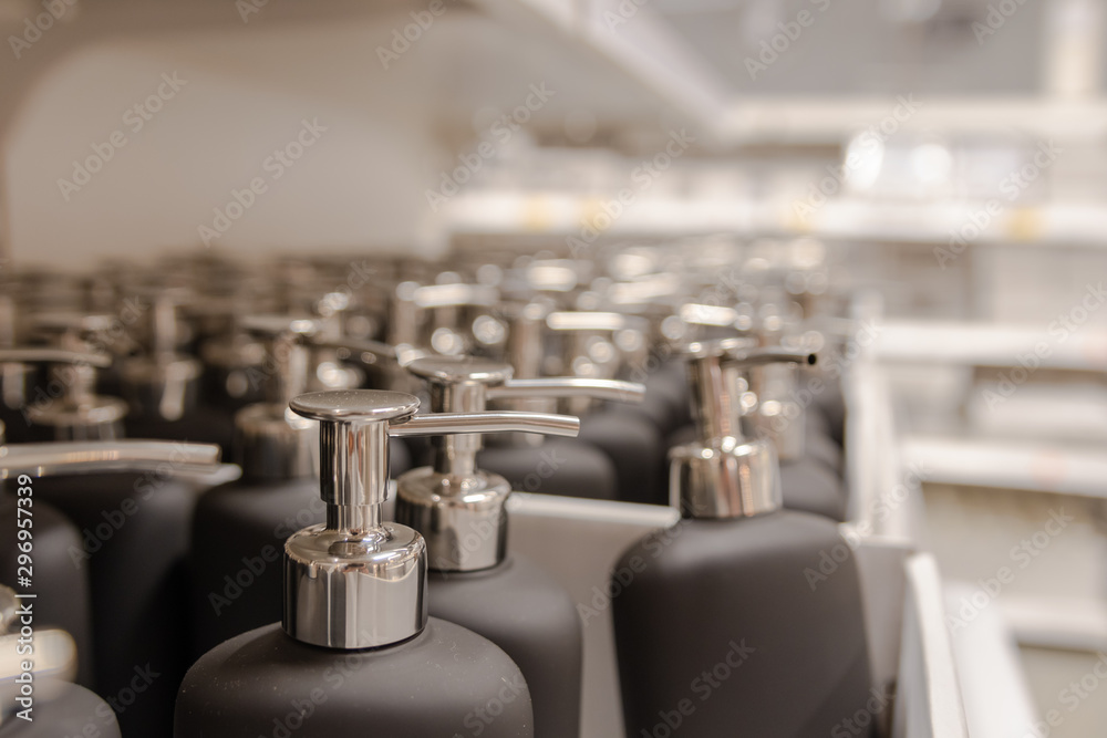 picture of many soap dispenser in a row ,displayed on shelves in a shop picture of many soap dispenser in a row ,displayed on shelves in a shop