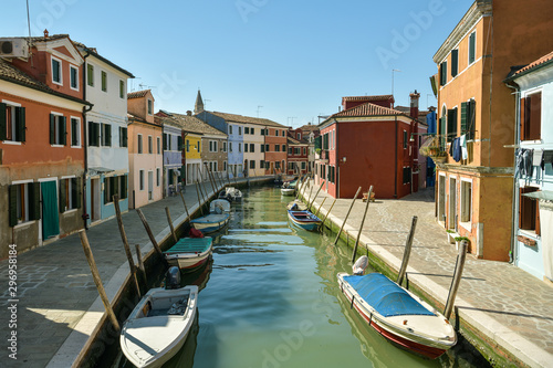 Colorful houses on Fondamenta Pontinello Destra street in quiet part of Burano village close to Venice © Michal