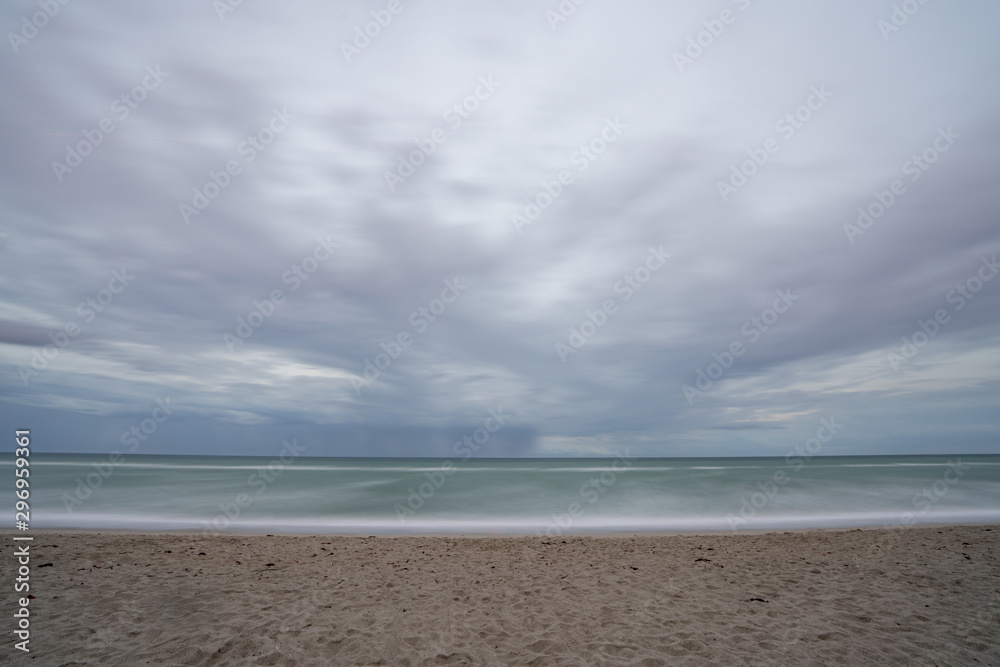 Long exposure beach scene motion blur in the waves