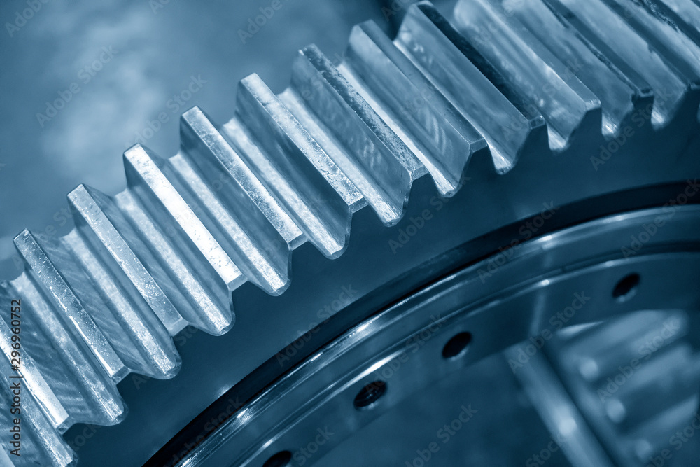 The close-up scene of the pinion gear in the light blue scene. The mechanical parts manufacturing process concept for automotive industrial . The close-up scene of the pinion gear in the light blue scene. The mechanical parts manufacturing process concept for automotive industrial .