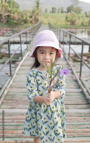 Portrait of happy little girl in hat 