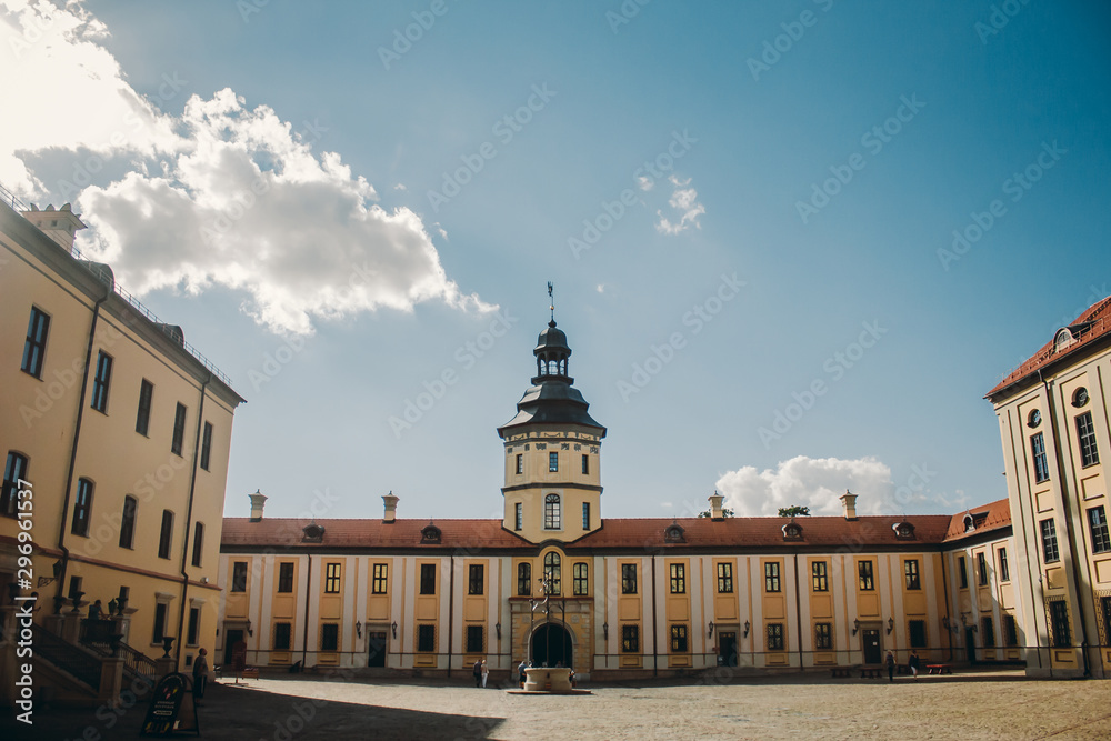 Nesvizh Castle Courtyard with Picturesque Blue Sky Background at sunny summer day.