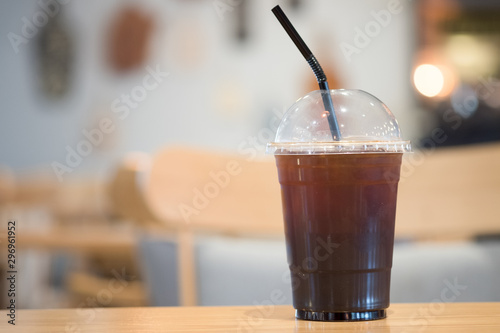 Ice black coffee on a wooden table