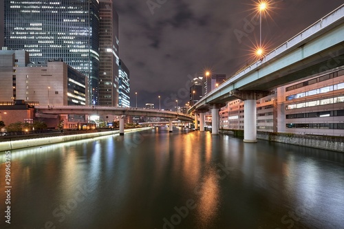 Osaka night scene, urban expressway bridges over the river in downtown Osaka, Japan