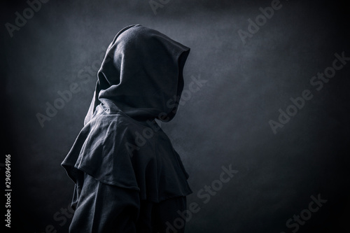 Scary figure in hooded cloak 