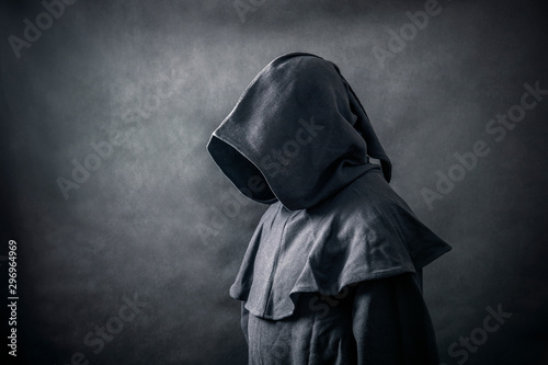 Scary figure in hooded cloak 