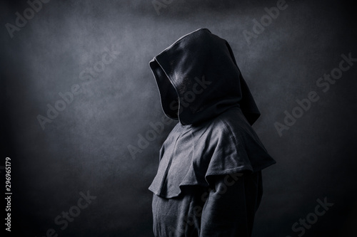 Scary figure in hooded cloak 