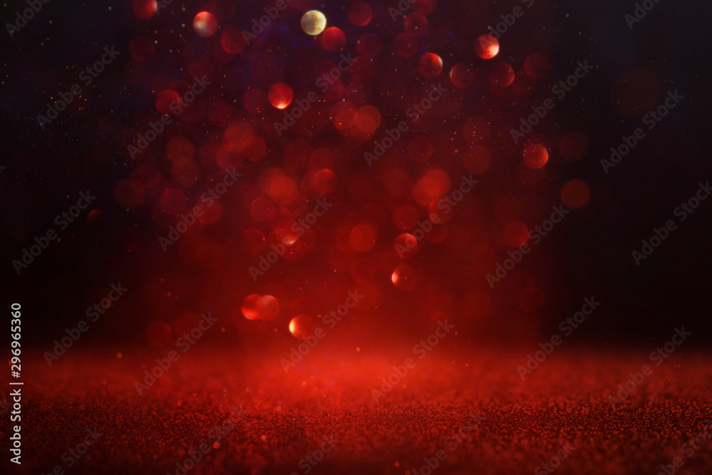 Fototapeta background of abstract red and gold glitter lights. defocused