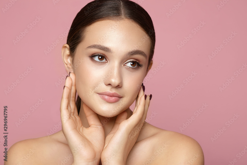 young girl clean skin with natural makeup on a pink background young girl clean skin with natural makeup on a pink background