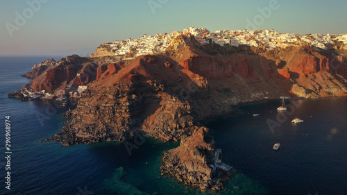 Aerial panoramic photo of iconic and famous for sunset village of Oia, Santorini island at sunset, Cyclades, Greece