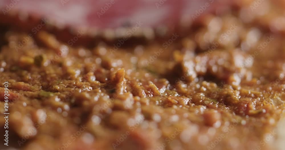 Extreme closeup slow motion laying salami slices on ciabatta Extreme closeup slow motion laying salami slices on ciabatta