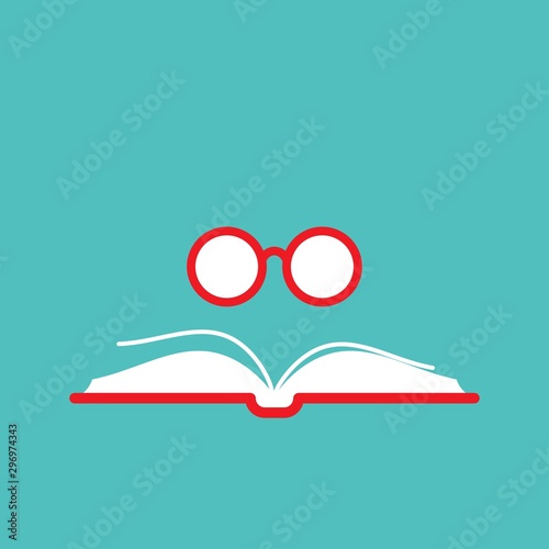 Opened book with red book cover and round red glasses on turquoise background.