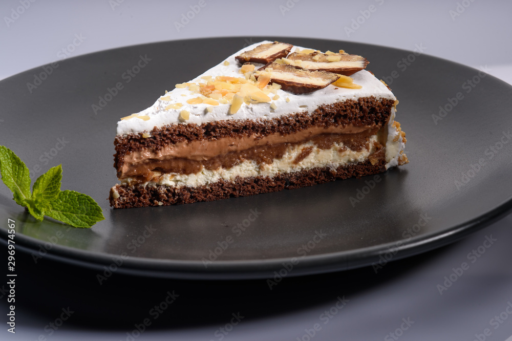 delicious cake with chocolate cream on a black plate9 delicious cake with chocolate cream on a black plate9